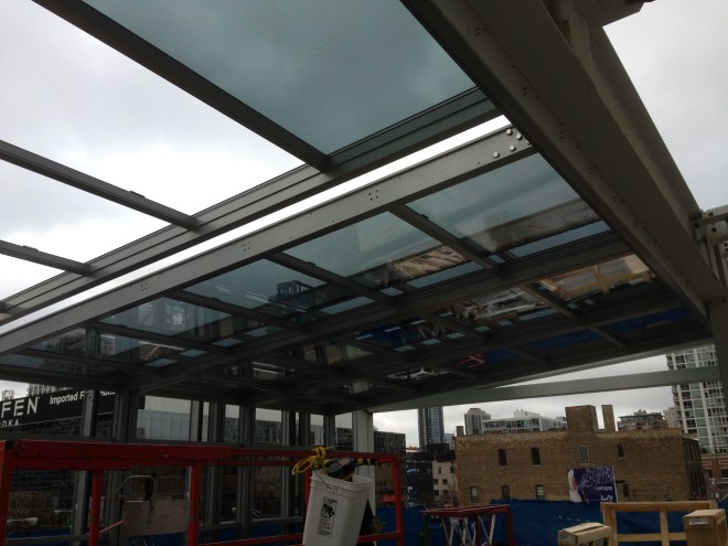 The retractable roof being installed at I|O Urban Roofscape.